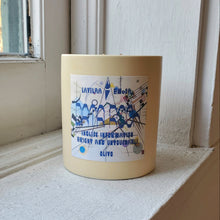 Load image into Gallery viewer, Yellow candle with a label on a windowsill