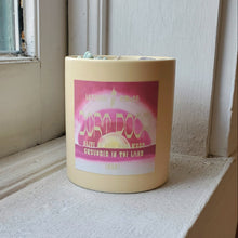 Load image into Gallery viewer, Candle with a pink label on a windowsill
